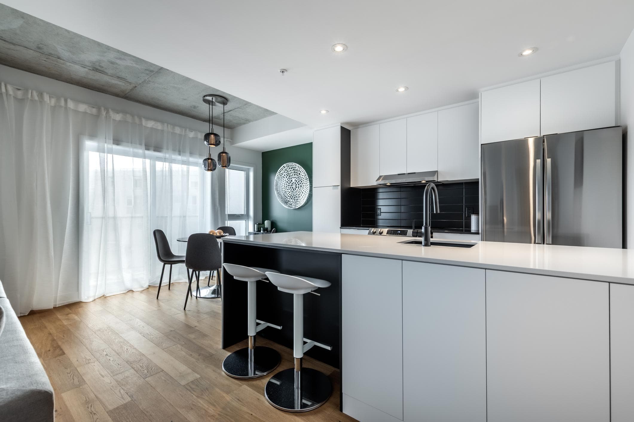 A minimalist Airbnb-style condo kitchen ready for guest turnover